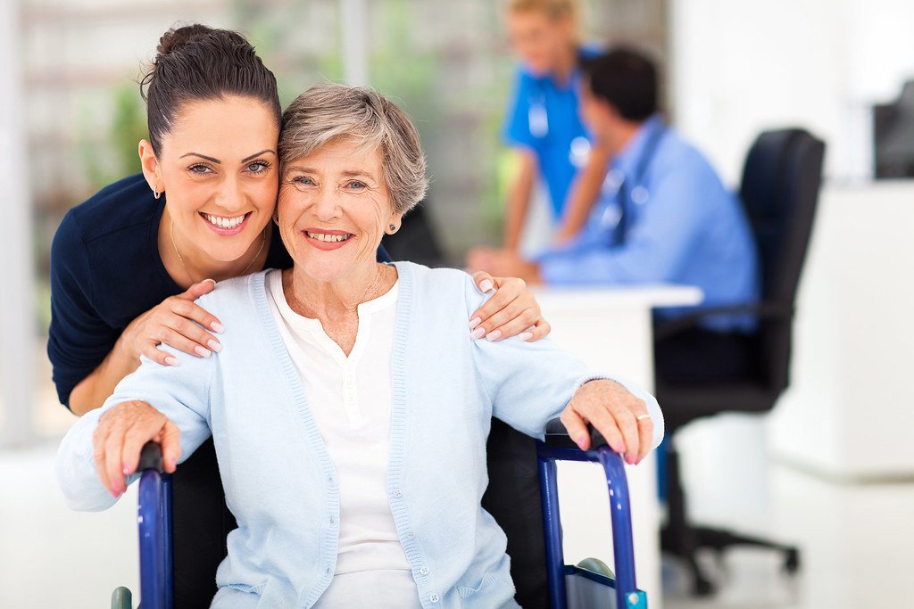 Daughter accompanying her senior mother to an appointment